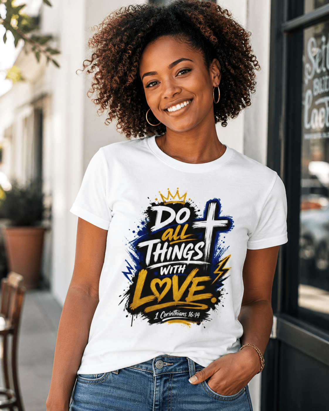 White T-shirt on smiling model with 'Do all things with love' crown cross graphic