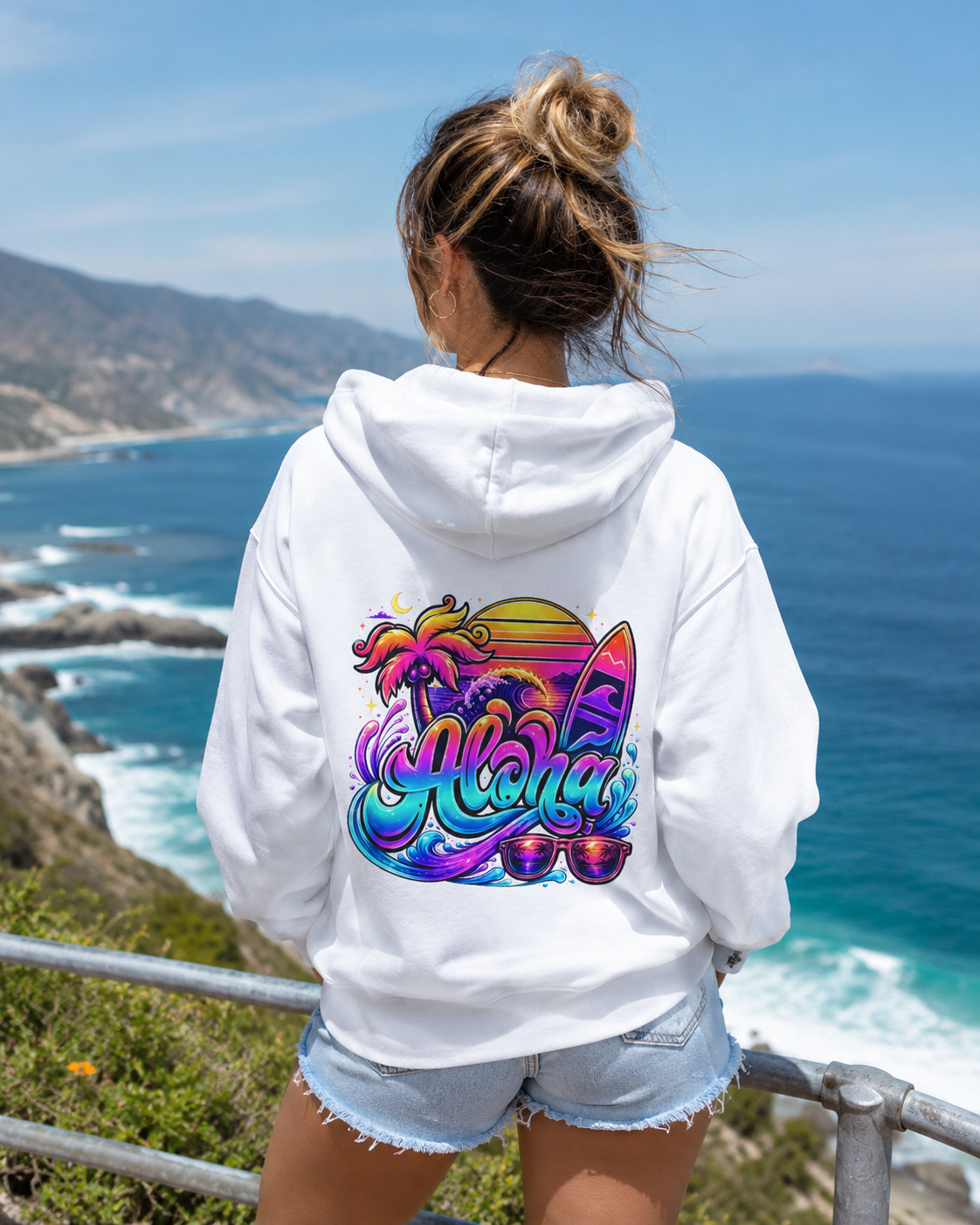 White hoodie with colorful Aloha surf graphic on the back