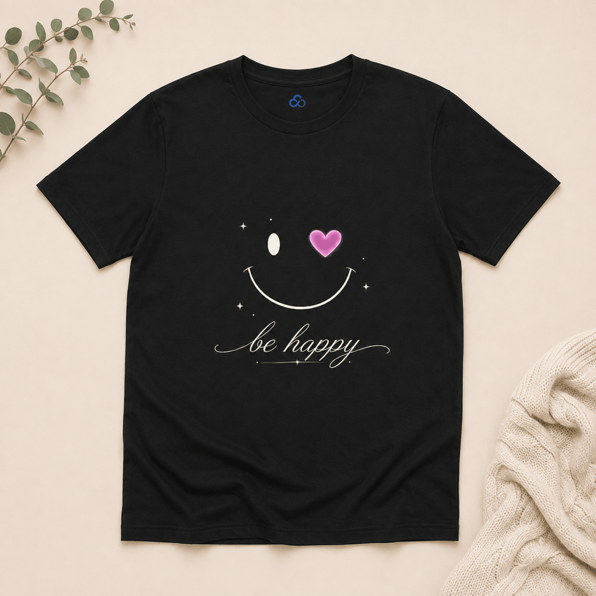 Black T-shirt with smiling face graphic, pink heart and 'be happy' script