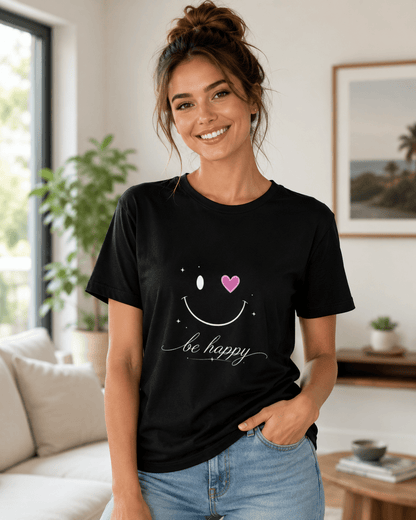 Black T-shirt on woman with smiling face graphic, pink heart and 'be happy' text
