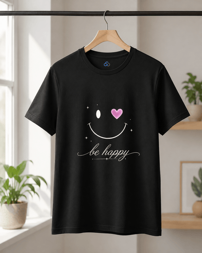 Black T-shirt on hanger with smiley face graphic, pink heart and 'be happy' text