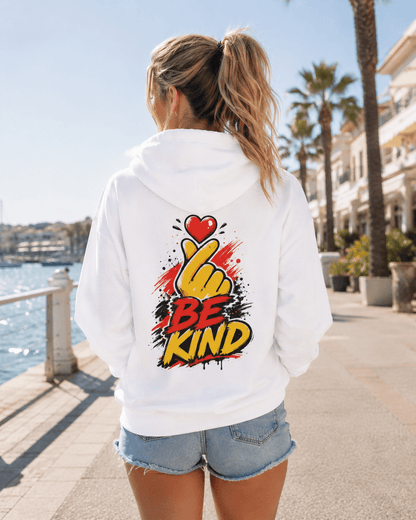 White hoodie worn from behind with 'Be Kind' heart-and-hand graphic