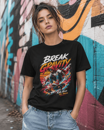A woman wearing a black graphic t-shirt with a colorful 'Break Gravity' print, standing in front of a vibrant graffiti-covered wall.