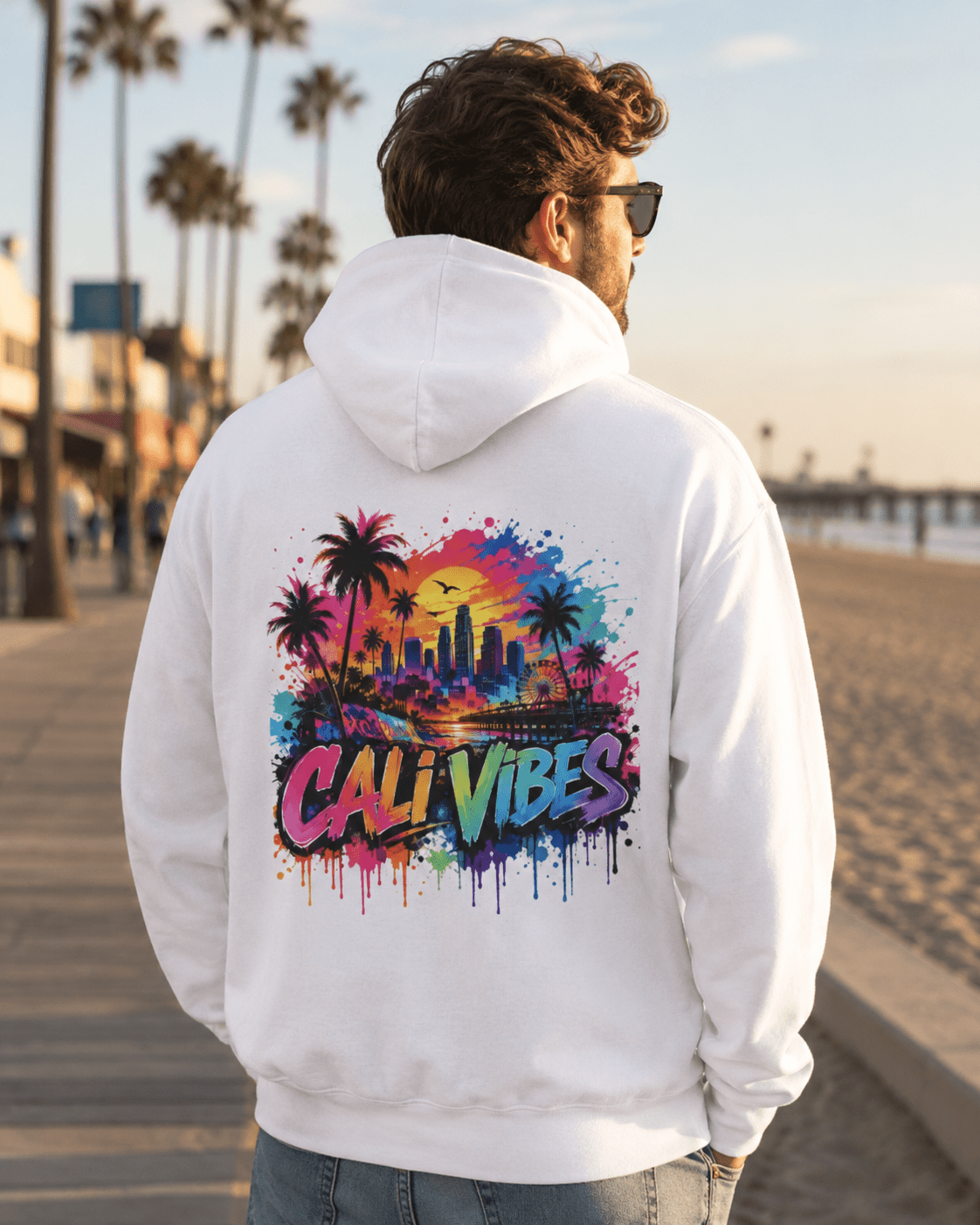 White hoodie worn from the back with “Cali Vibes” city palm graphic