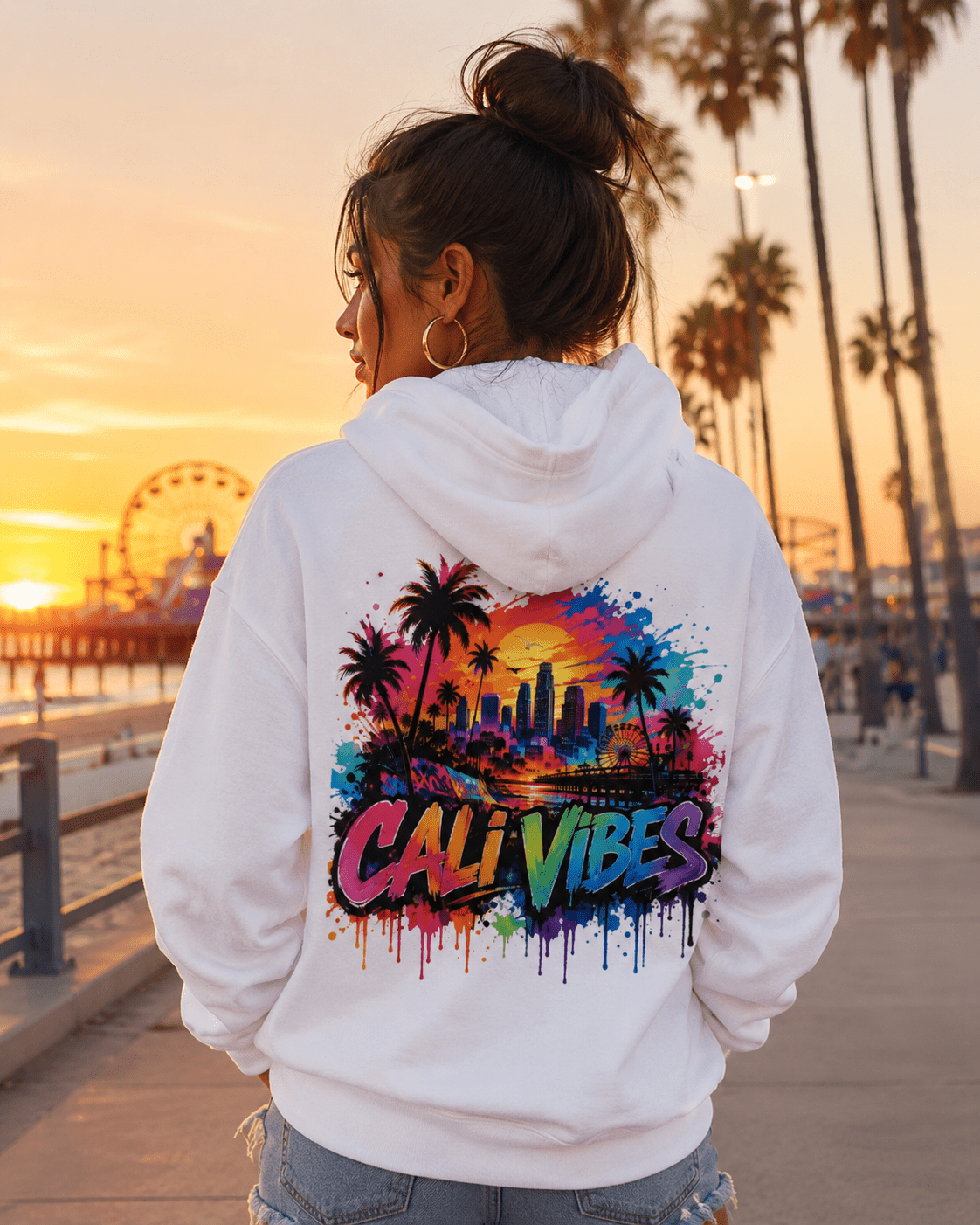 White hoodie worn from the back with “Cali Vibes” city palm splash print
