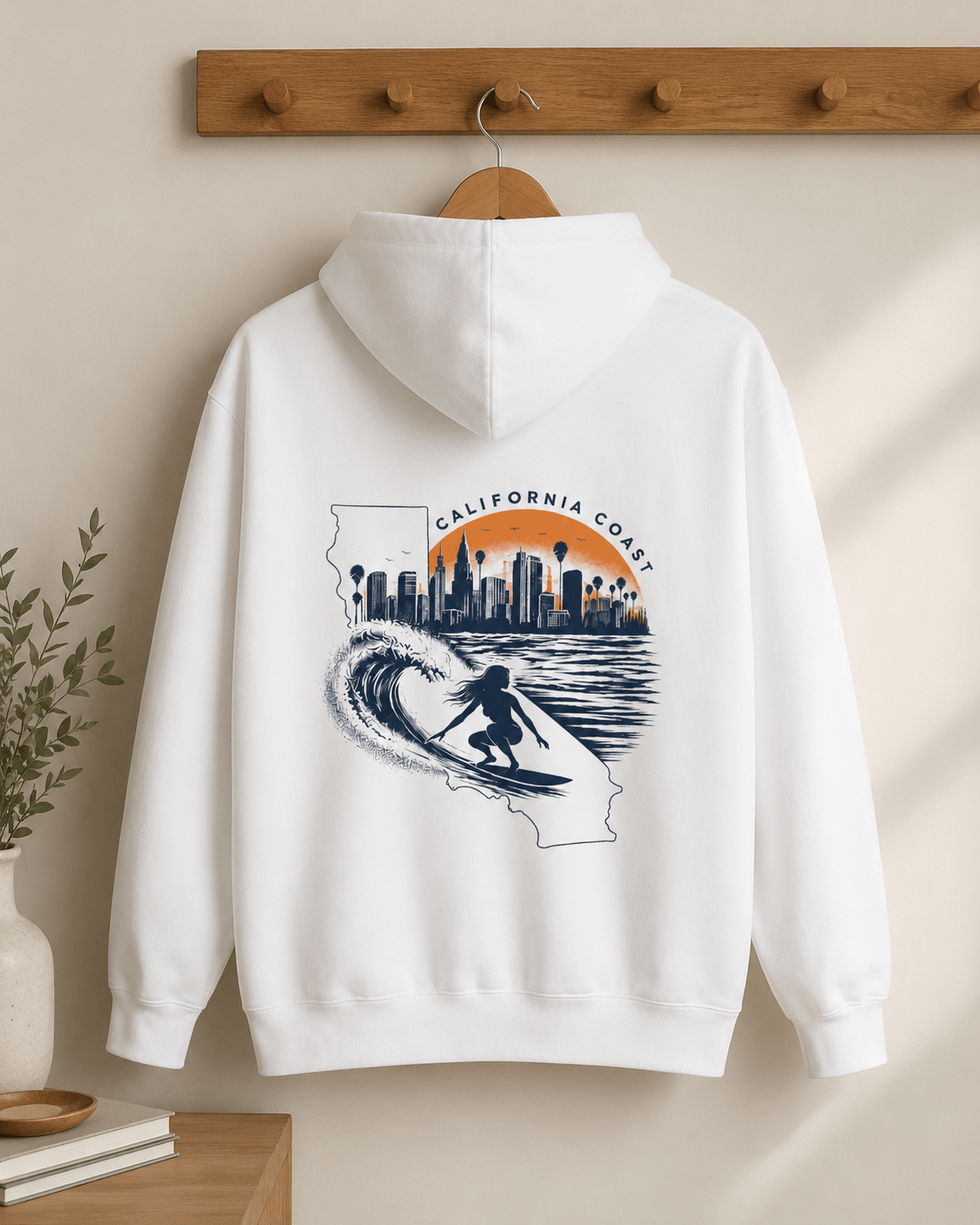 White California coast hoodie on hanger; back surf and city skyline graphic