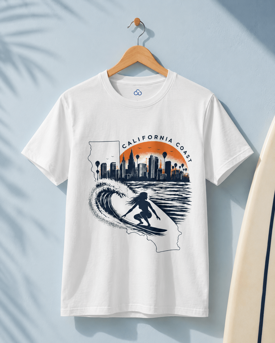 White graphic T-shirt with California outline, skyline, and wave surfer print on front