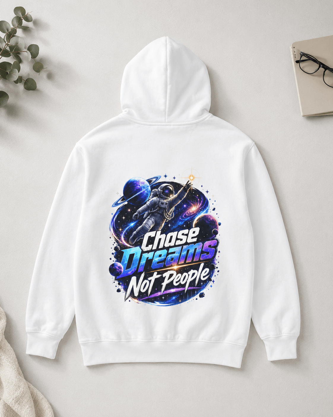White pullover hoodie with astronaut graphic and colorful text print on back