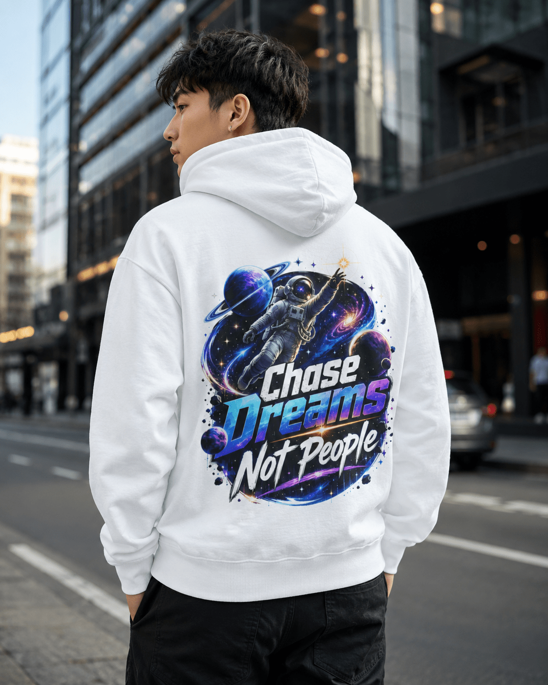 White pullover hoodie worn by model, back astronaut graphic with colorful text