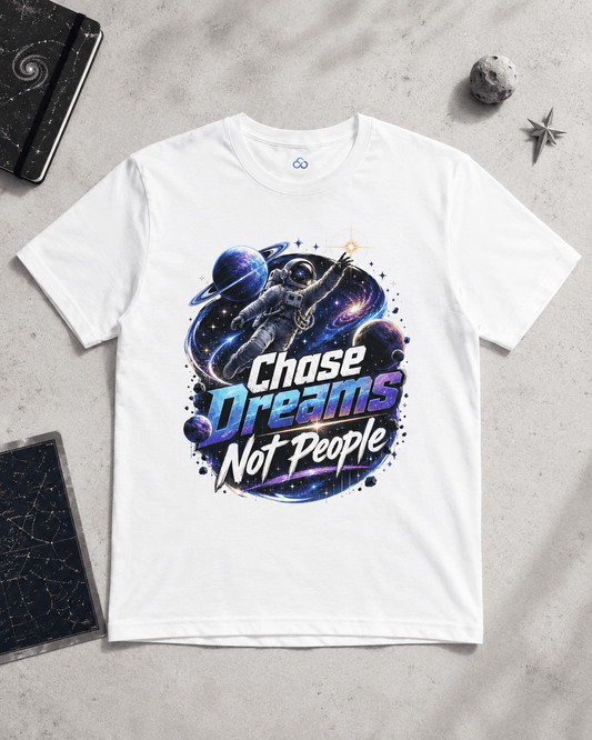 White graphic T-shirt with astronaut, “Chase Dreams Not People” print on chest.