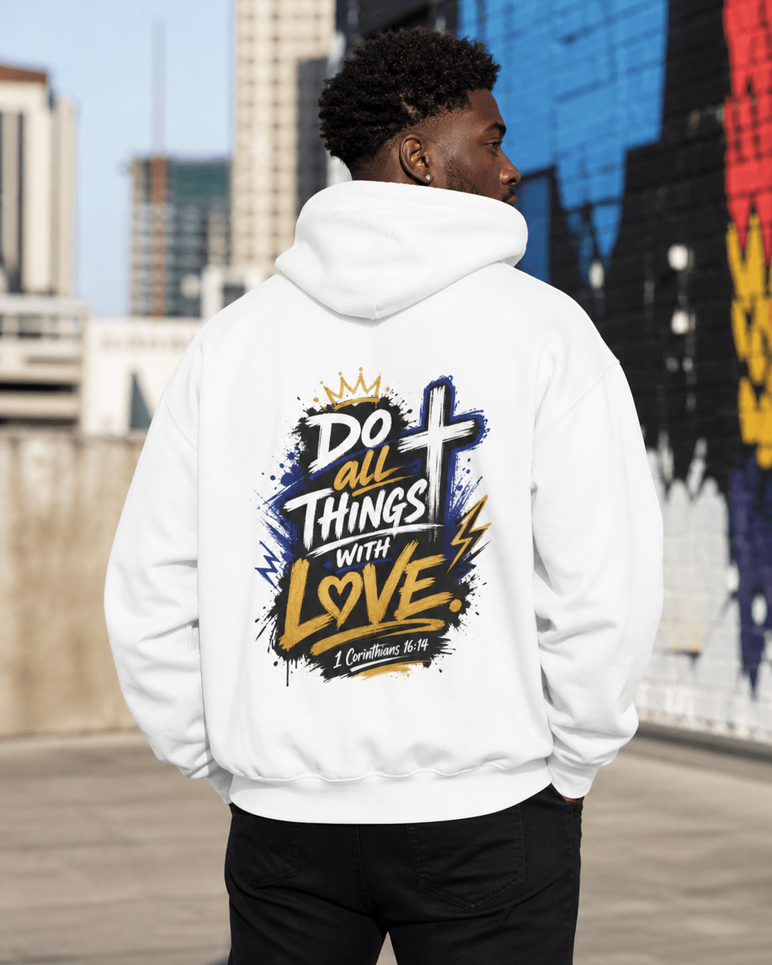 White hoodie with back print featuring crown, cross, and heart on dark splashes