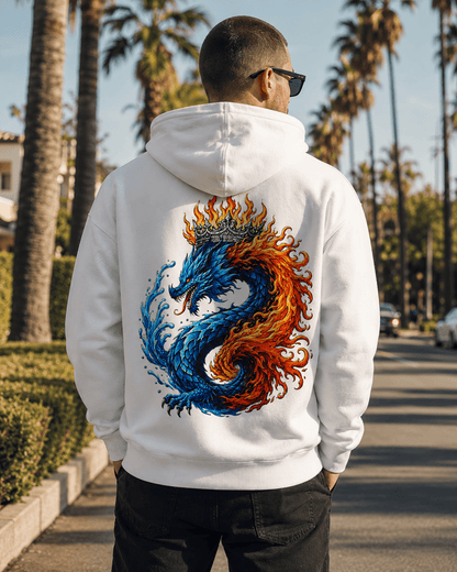 White hoodie with dragon flame graphic on the back, worn by a person outdoors