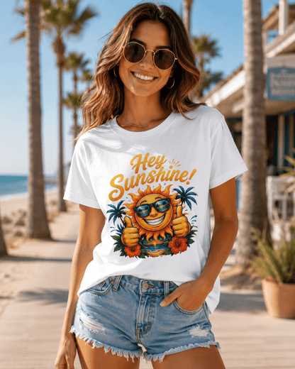 White crew-neck T-shirt on model, “Hey Sunshine!” smiling sun graphic with sunglasses.