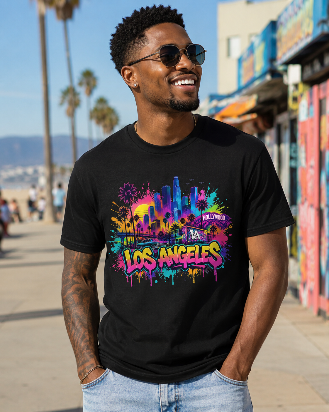 Black T-shirt featuring vibrant Los Angeles skyline, palm trees, and “Hollywood” print