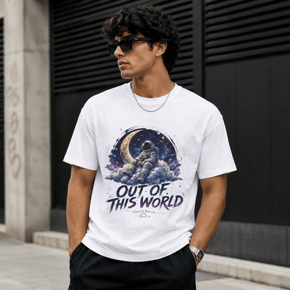Person wearing a white t-shirt with an astronaut graphic and 'Out of This World' text.