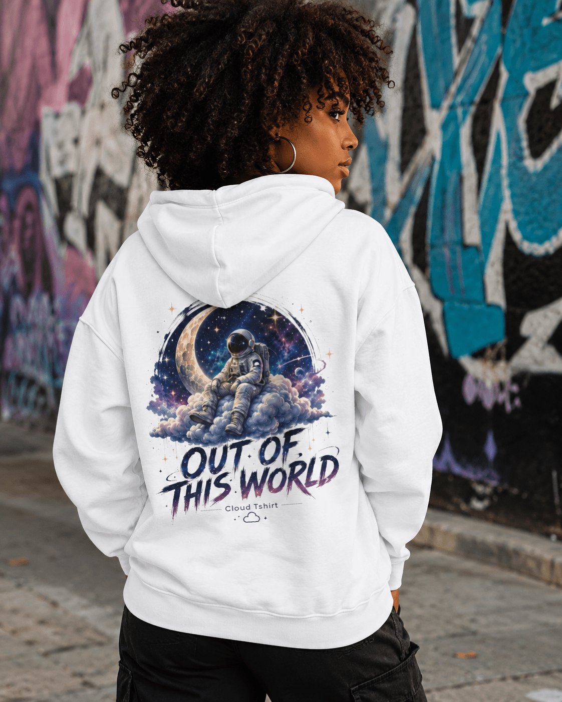 White hoodie, back view with astronaut space graphic and "Out of This World" text