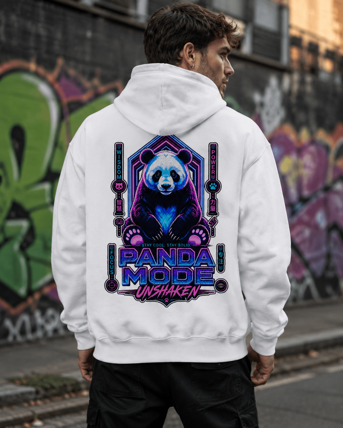 White hoodie back view with centered panda graphic on outdoor wall