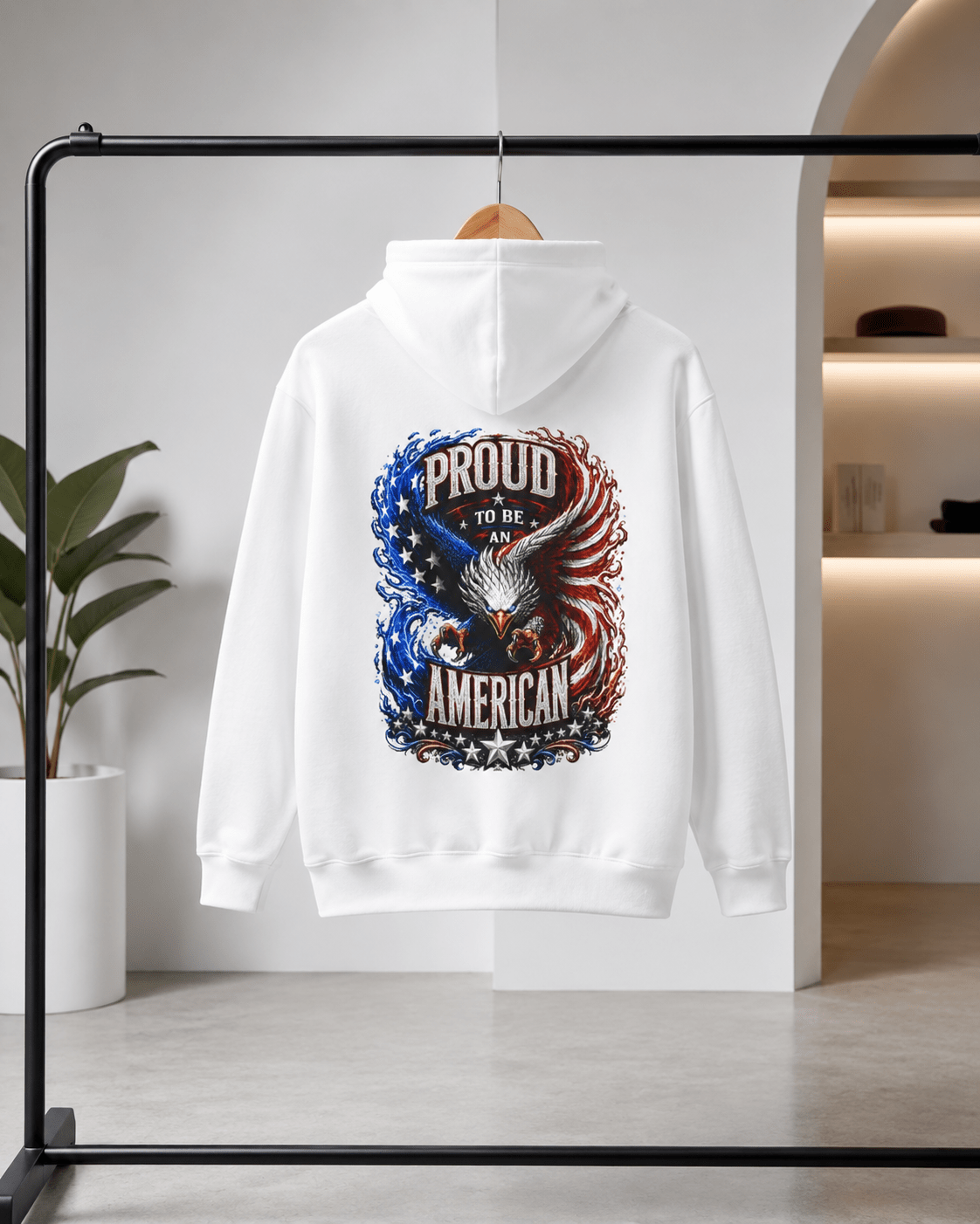 White hoodie on a hanger; Proud American eagle graphic centered on the back