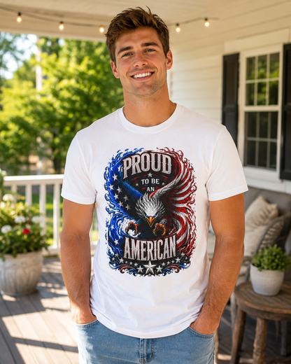 A smiling man wearing a white graphic t-shirt with a patriotic eagle design and the text 'PROUD TO BE AN AMERICAN' on a porch.