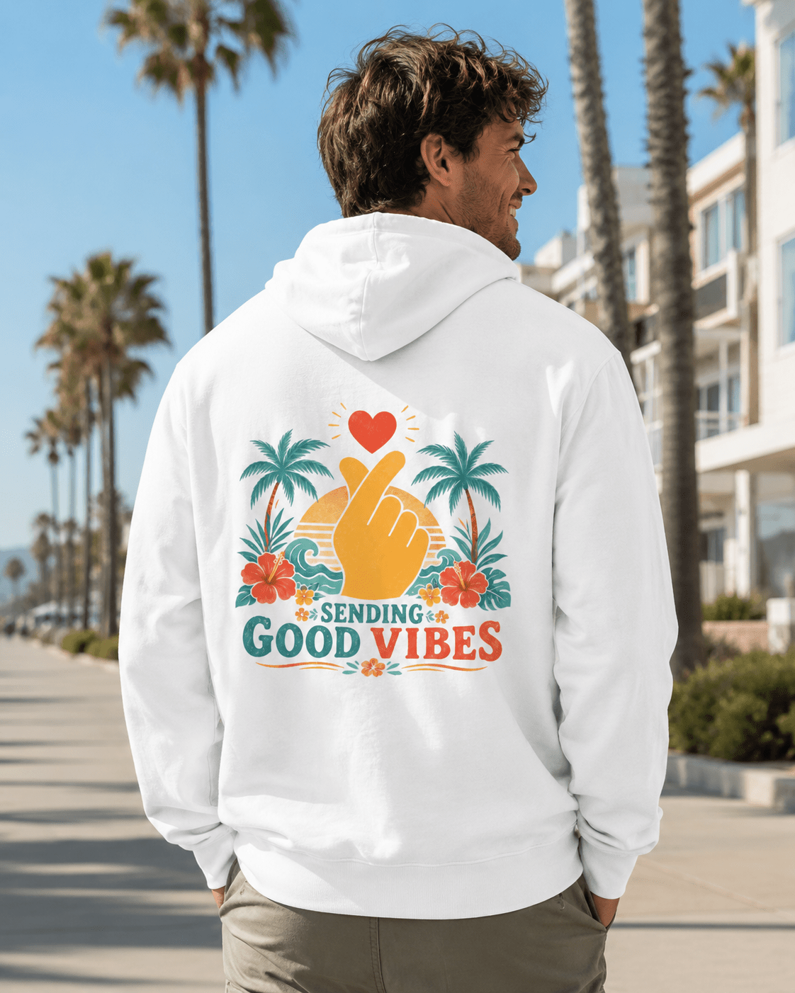 White hoodie with hood and back Good Vibes palm-heart graphic, worn by model