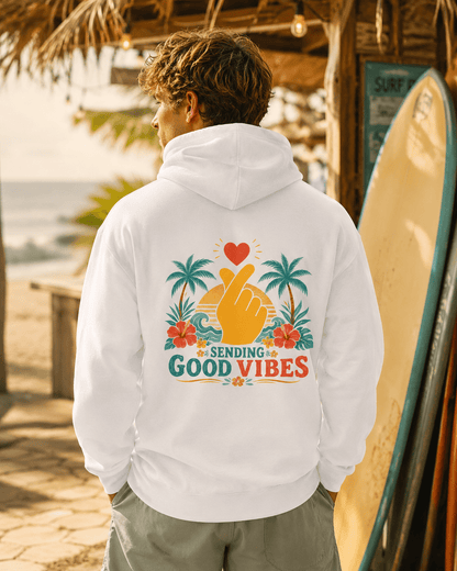 White hoodie with hood and back Good Vibes palm-heart graphic, worn from behind