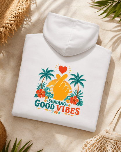 White hoodie laid flat, hood up, with colorful palm-heart Good Vibes back print