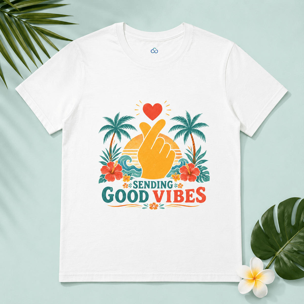 White Sending Good Vibes T-shirt with heart-and-hand graphic and palm flowers