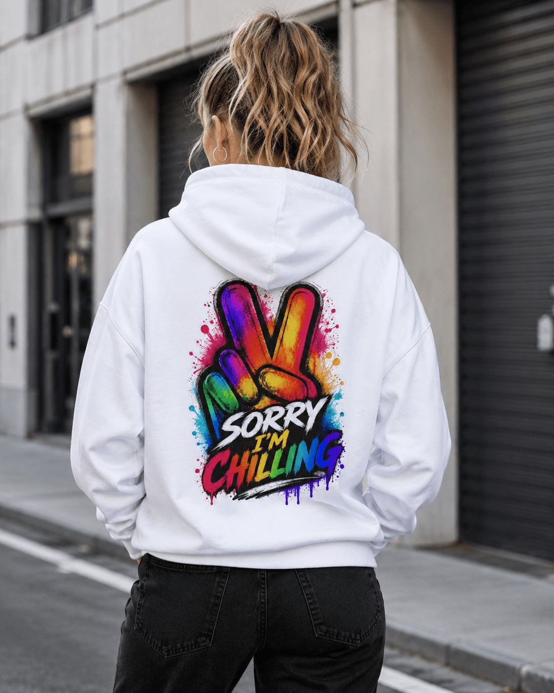 White hoodie worn from the back with Sorry I'm Chilling colorful graphic