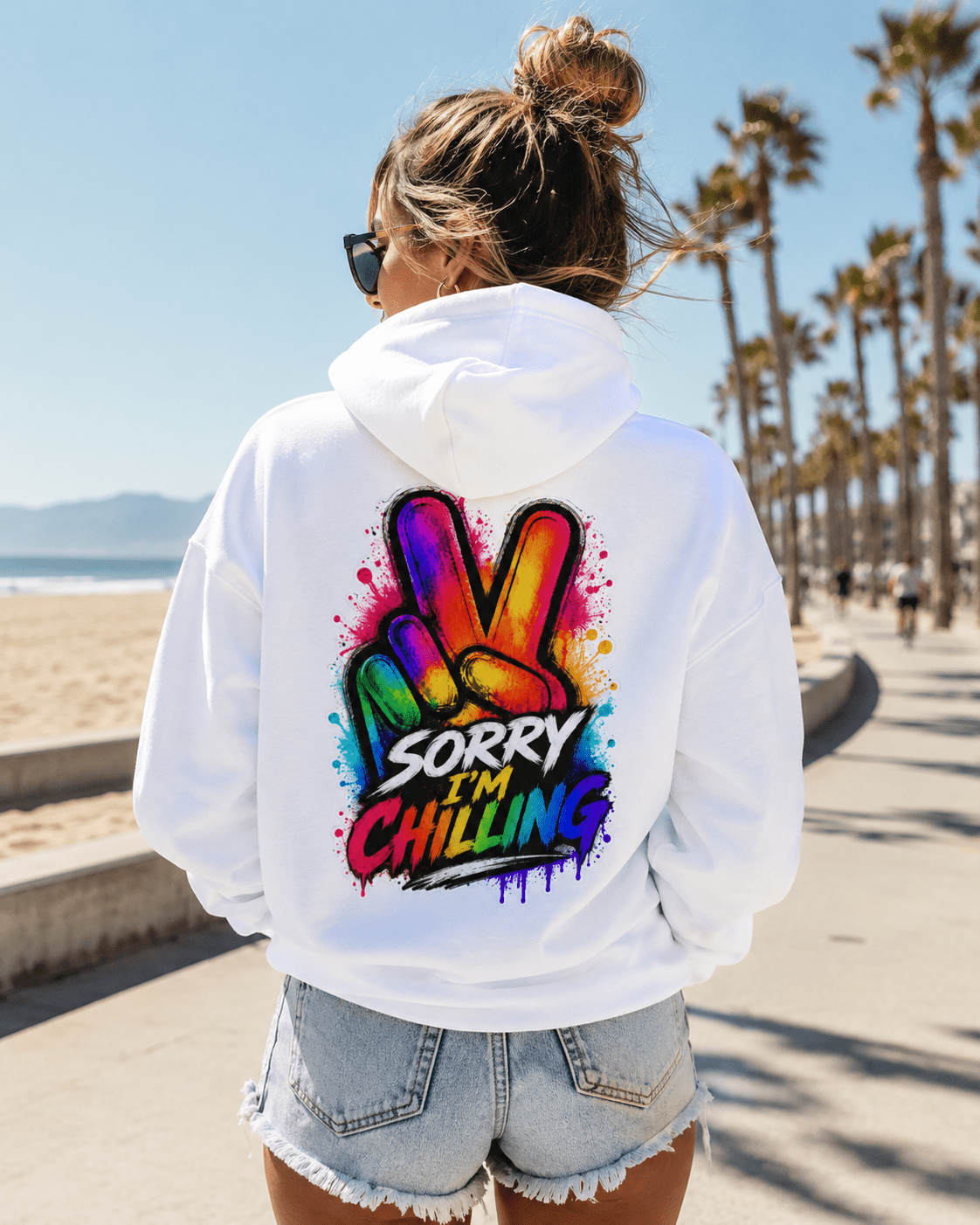 White hoodie back view with Sorry I'm Chilling colorful graphic