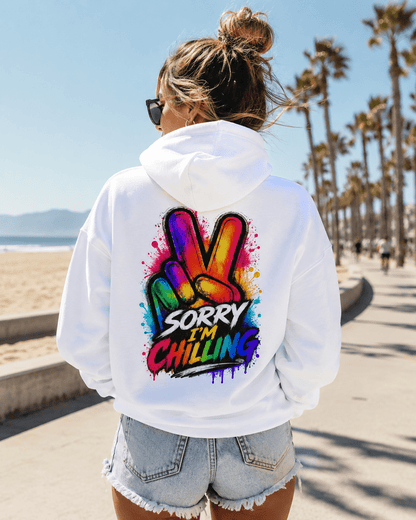 White hoodie back view with Sorry I'm Chilling colorful graphic