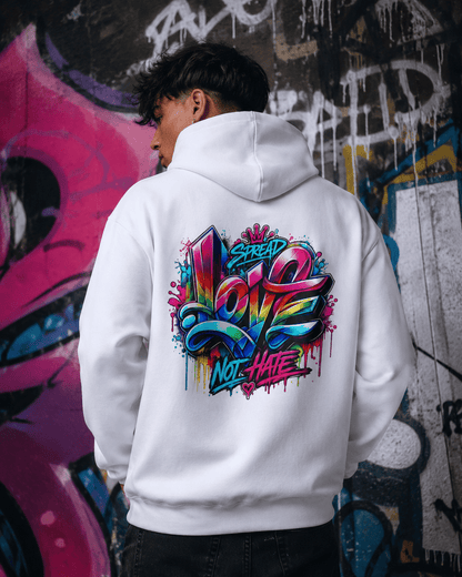 White hoodie worn from behind with colorful back slogan graphic against graffiti