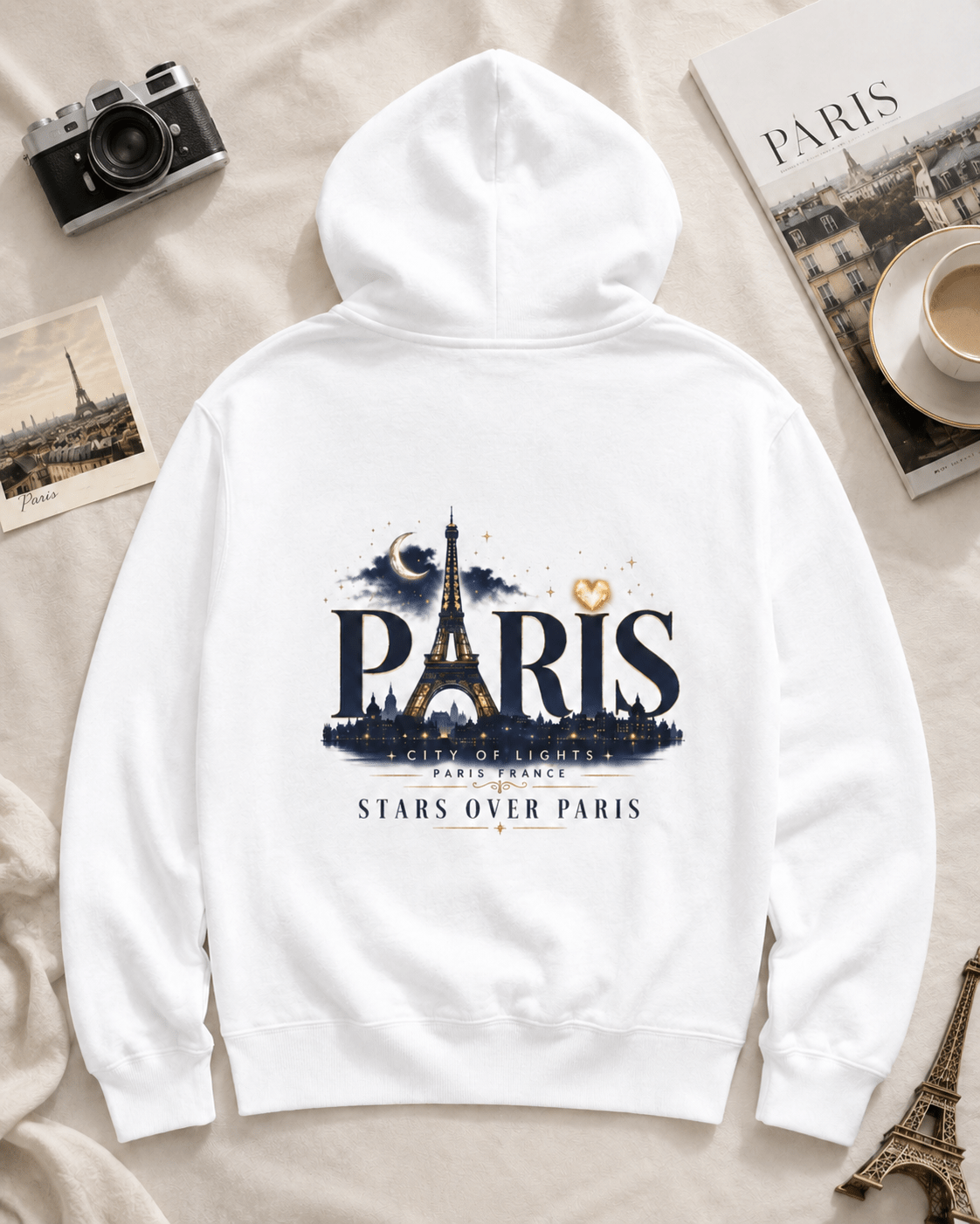 White hoodie with Paris back graphic featuring Eiffel Tower and stars