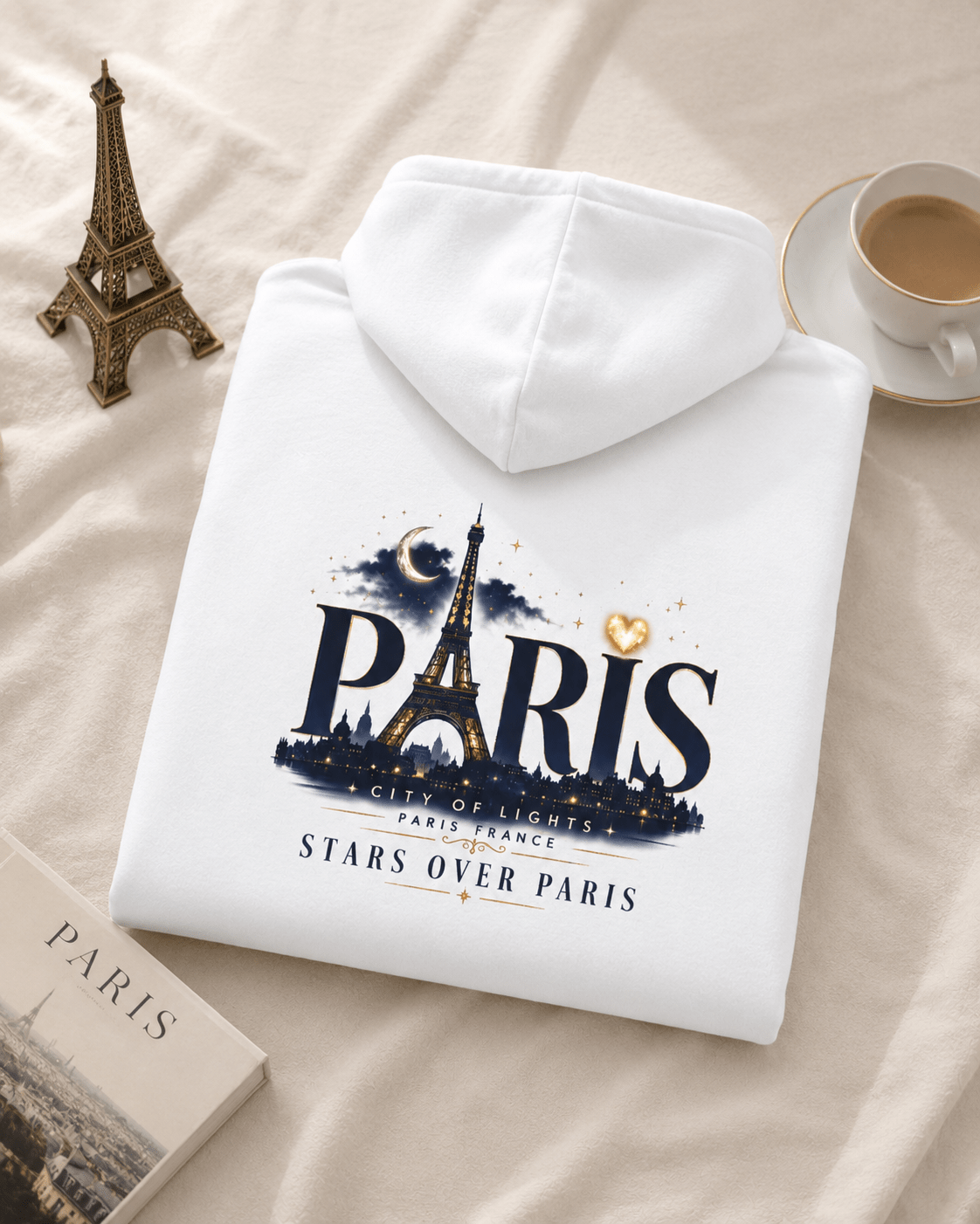 White hoodie folded with Paris back graphic and Eiffel Tower star design