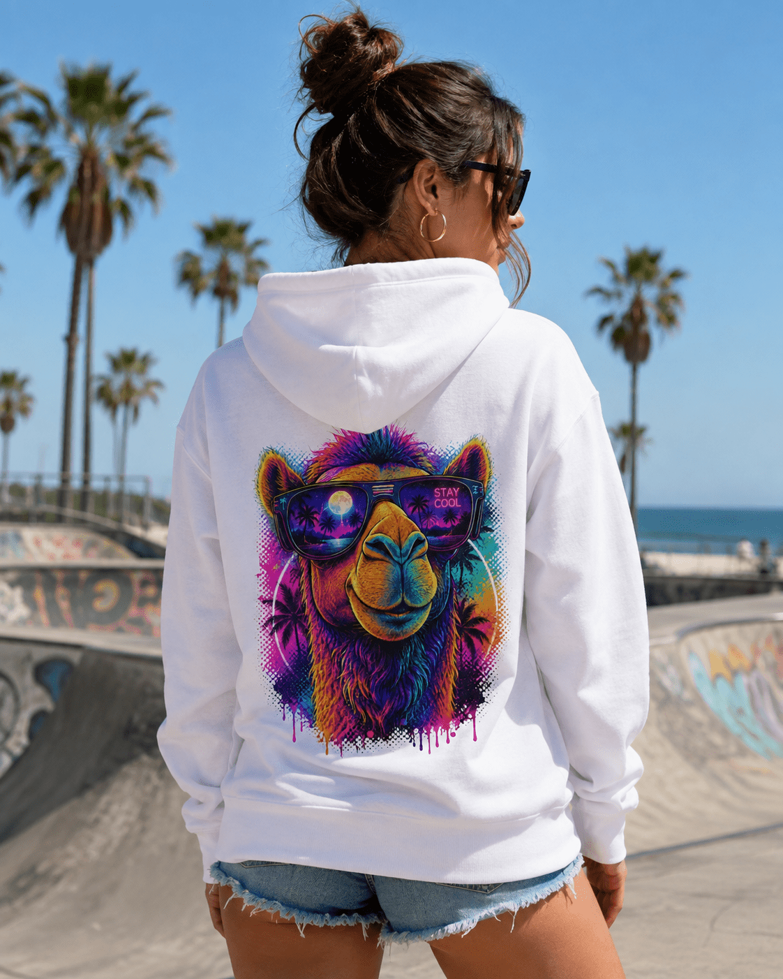 White hoodie with back camel face graphic, sunglasses, and 'STAY COOL' text, worn