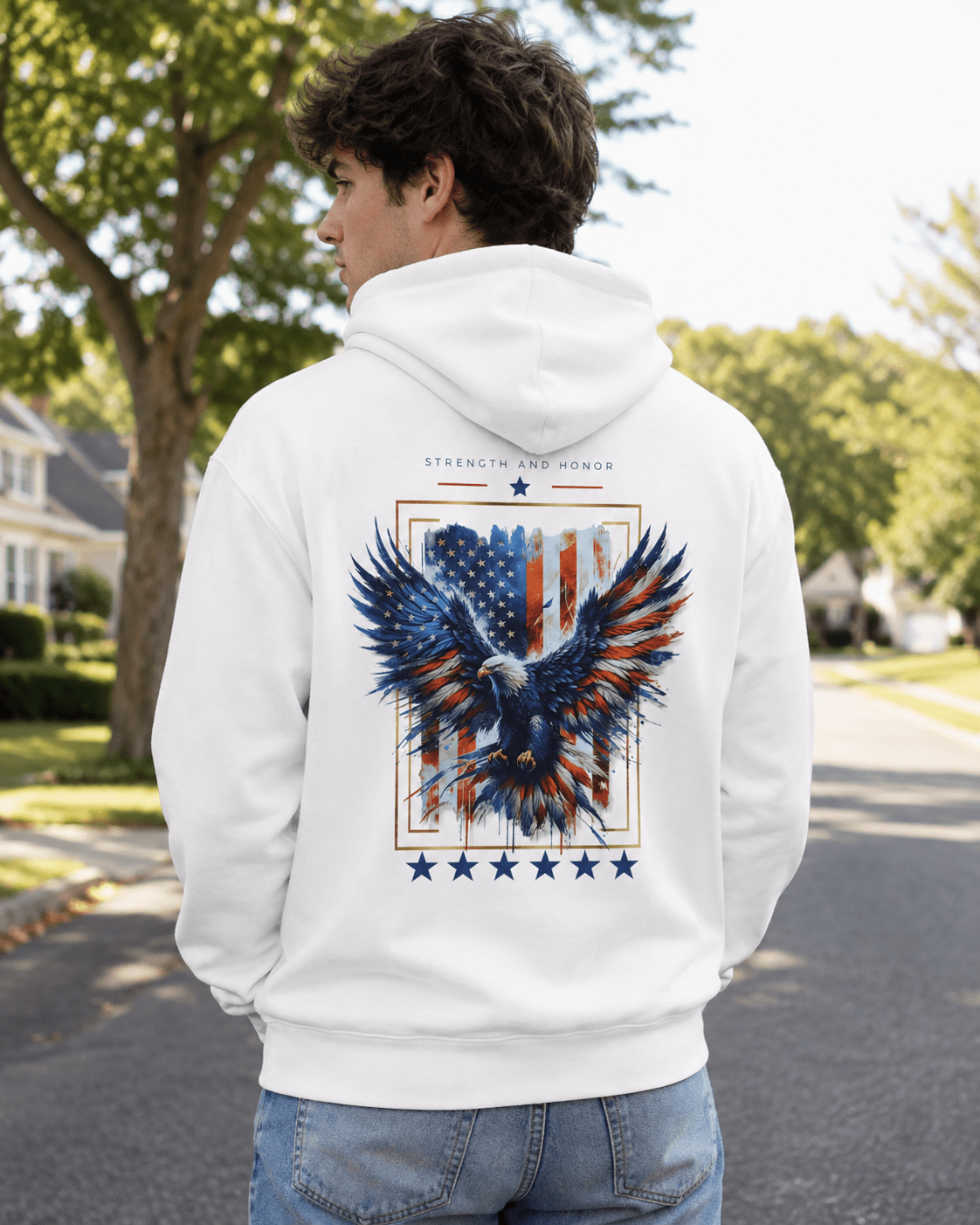 White hoodie worn outdoors, back eagle and stars graphic centered over the shoulders