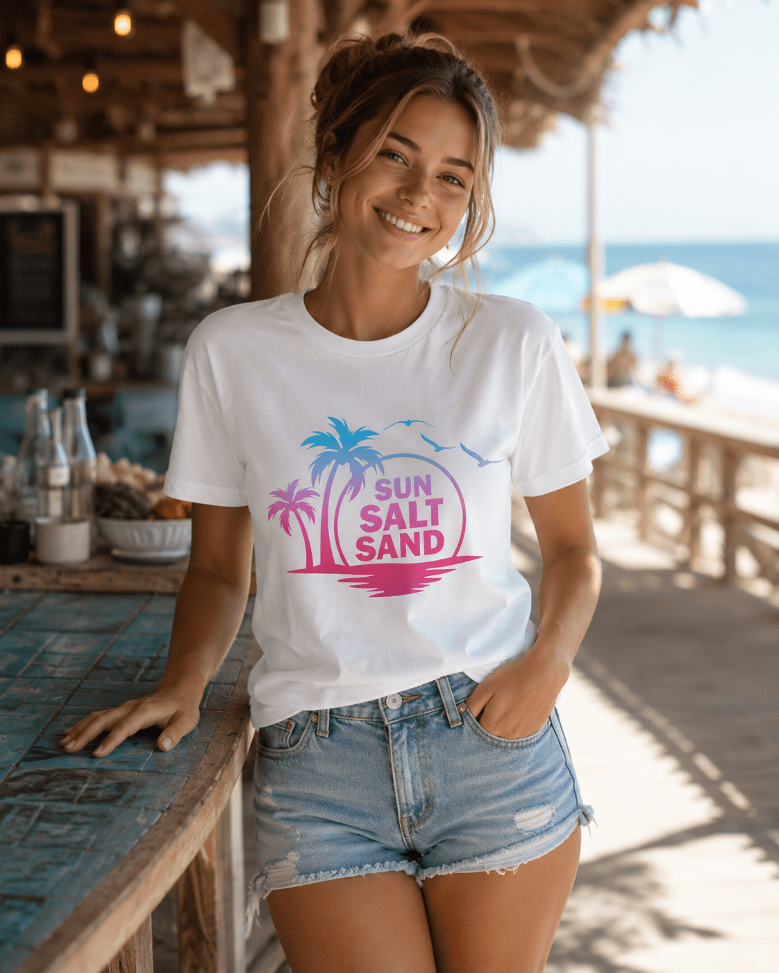 White Sun Salt Sand T-shirt with small palm island graphic and multicolor text