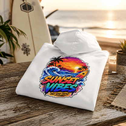 Folded white hoodie with colorful beach sunset graphic on back