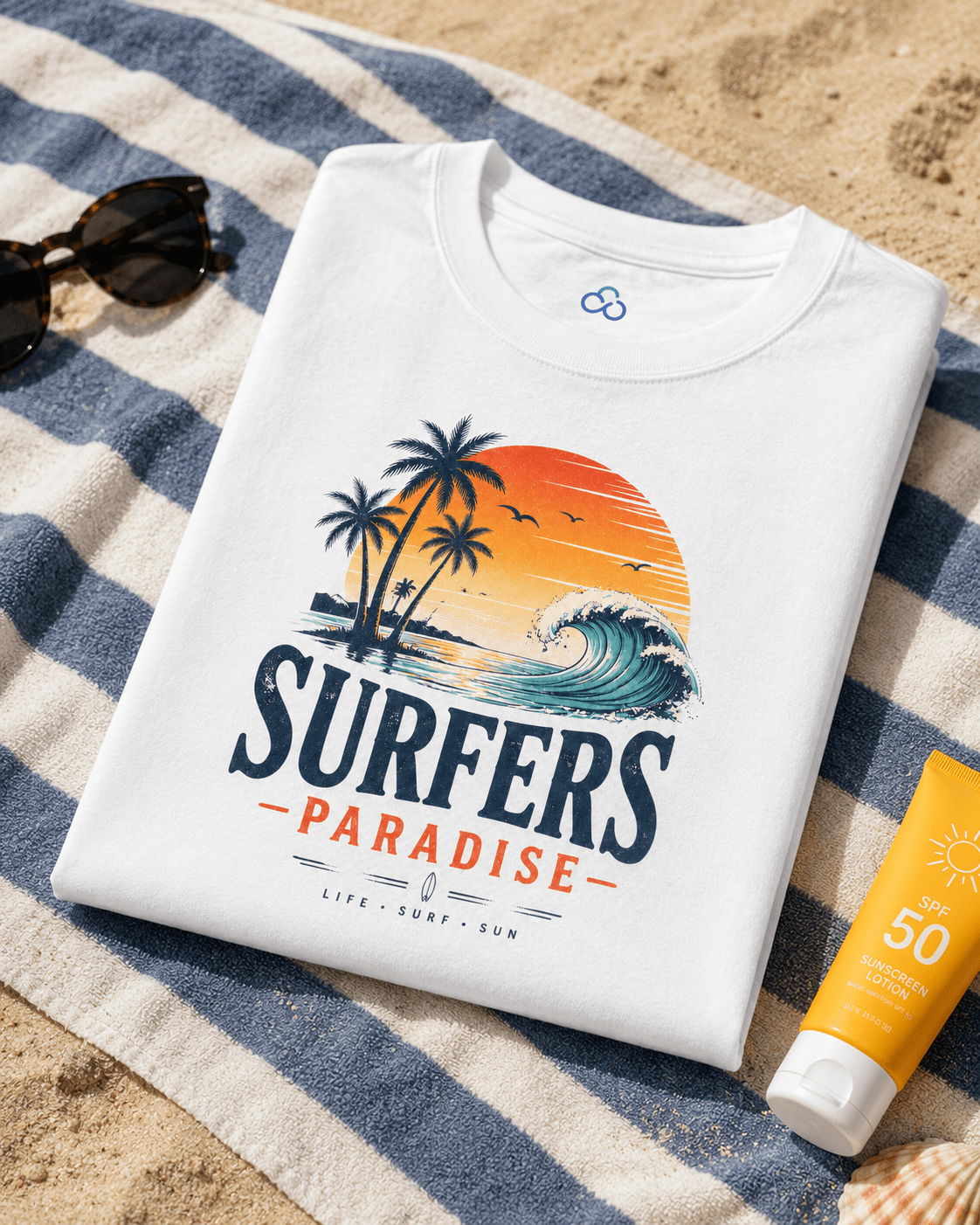 Folded white T-shirt with surfers paradise surf graphic and blue infinity logo
