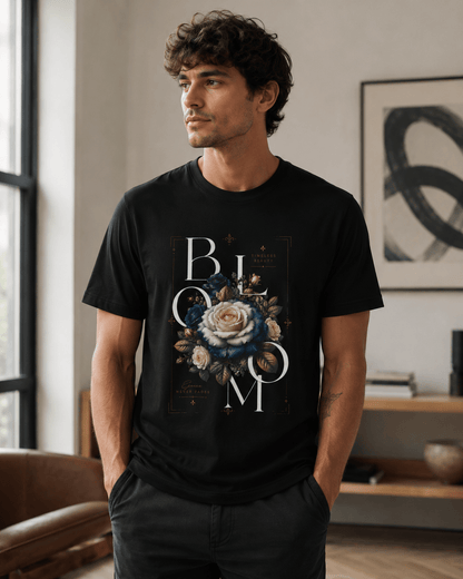 Man wearing a black t-shirt with floral design and text in a room.