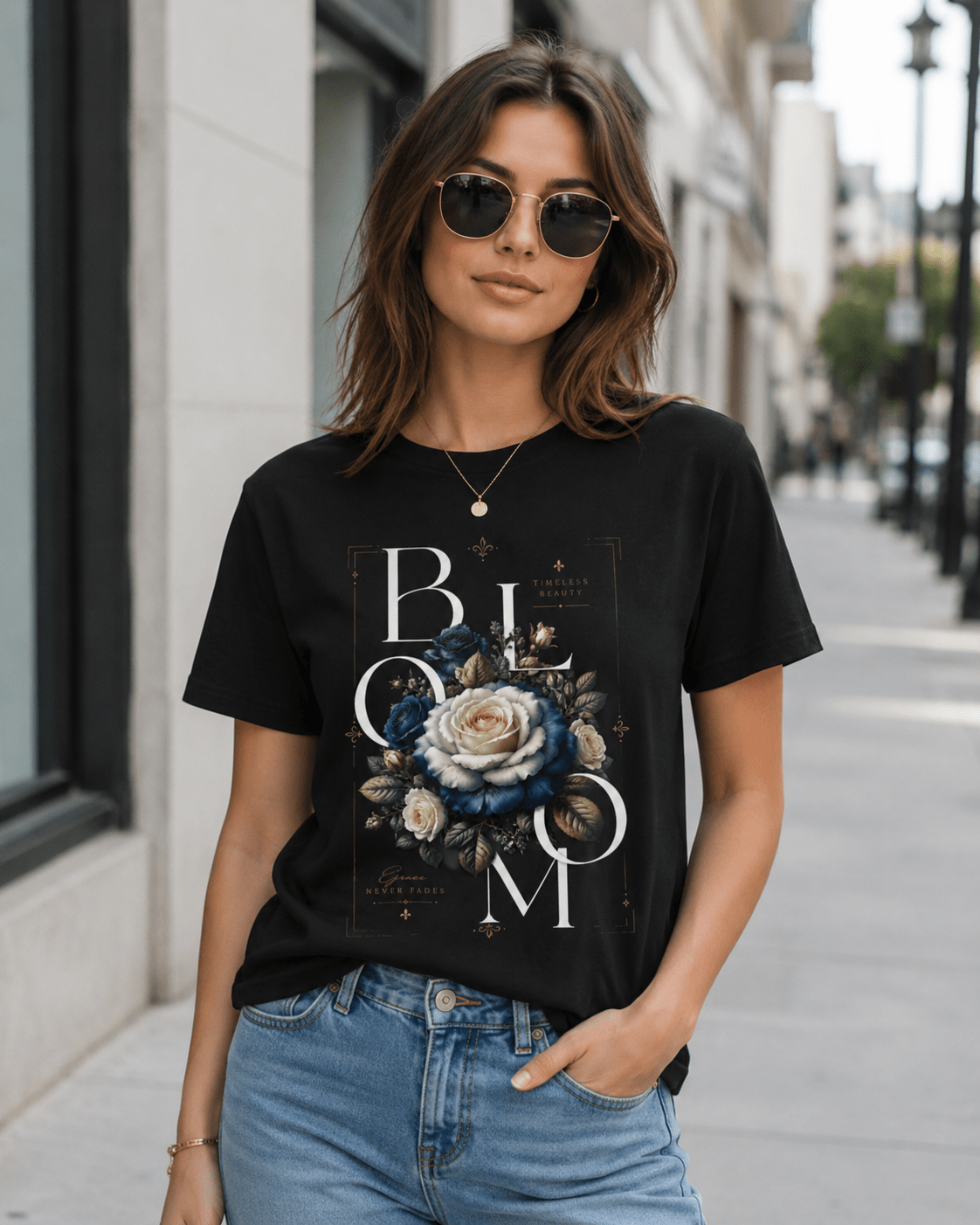 Woman wearing a black t-shirt with floral design and 'BLOOM' text on a city street.