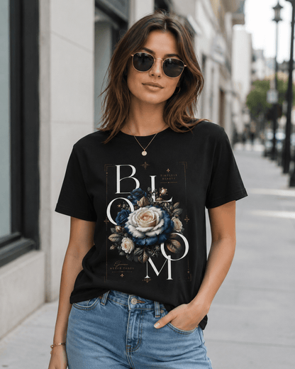 Woman wearing a black t-shirt with floral design and 'BLOOM' text on a city street.