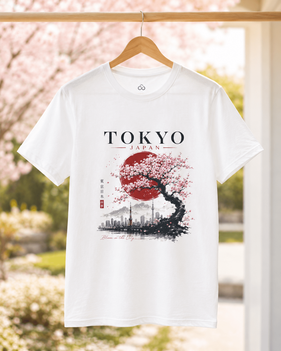 White T-shirt on hanger with “TOKYO JAPAN” graphic and cherry blossom tree design