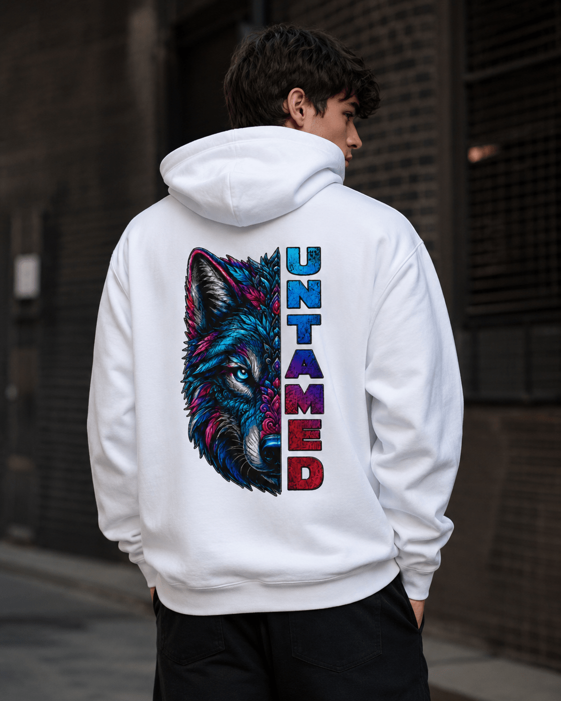 White pullover hoodie with wolf graphic and vertical UNTAMED print