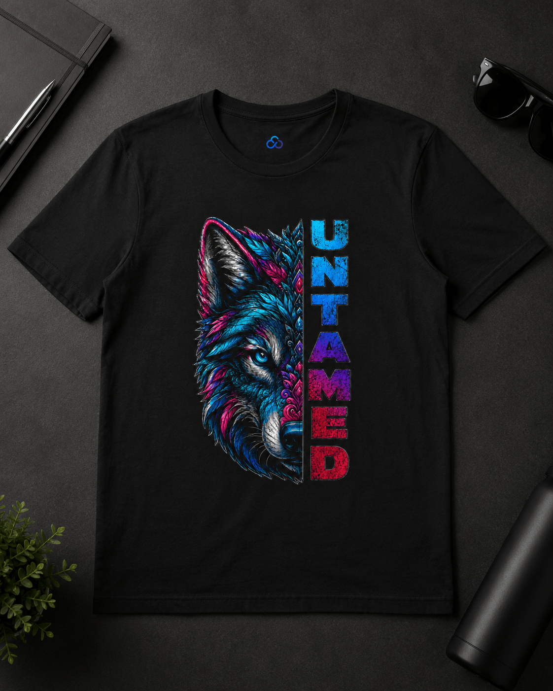 Black graphic T-shirt flat lay with colorful wolf face and vertical 'UNTAMED' text