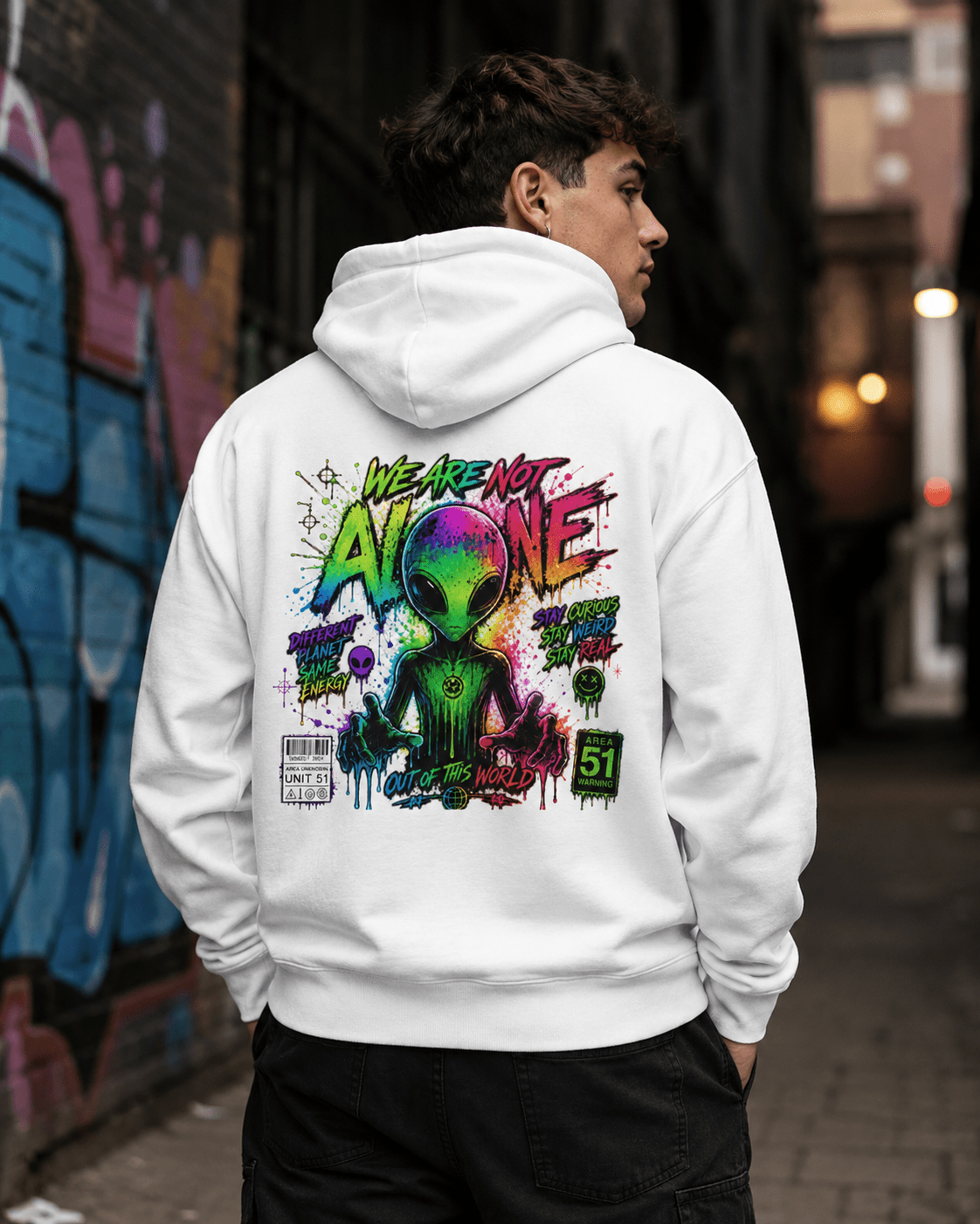 White hoodie worn from behind, featuring a colorful alien graphic print on the back