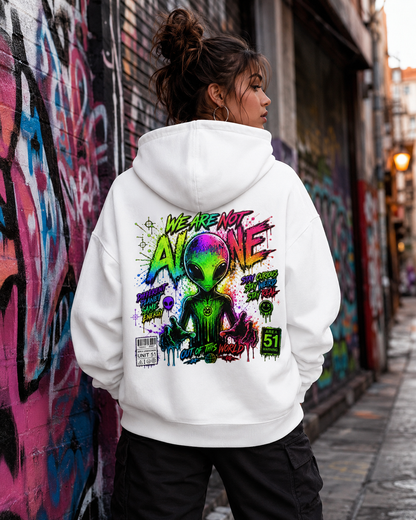 White hoodie worn outdoors, back view with colorful alien graphic print