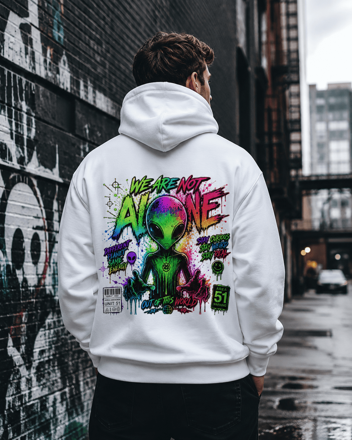White hoodie worn from behind, featuring a colorful alien graphic on the back